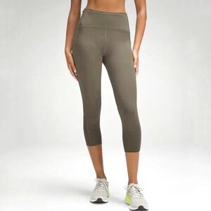 Lululemon Swift speed high rise crop tights 21” size 2 olive green